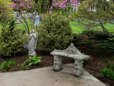 Outdoor sitting area surrounded by a beautiful garden